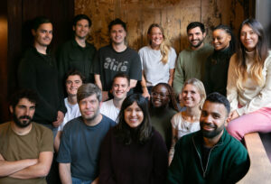 A group photo of the Surfboard team sat together in three rows